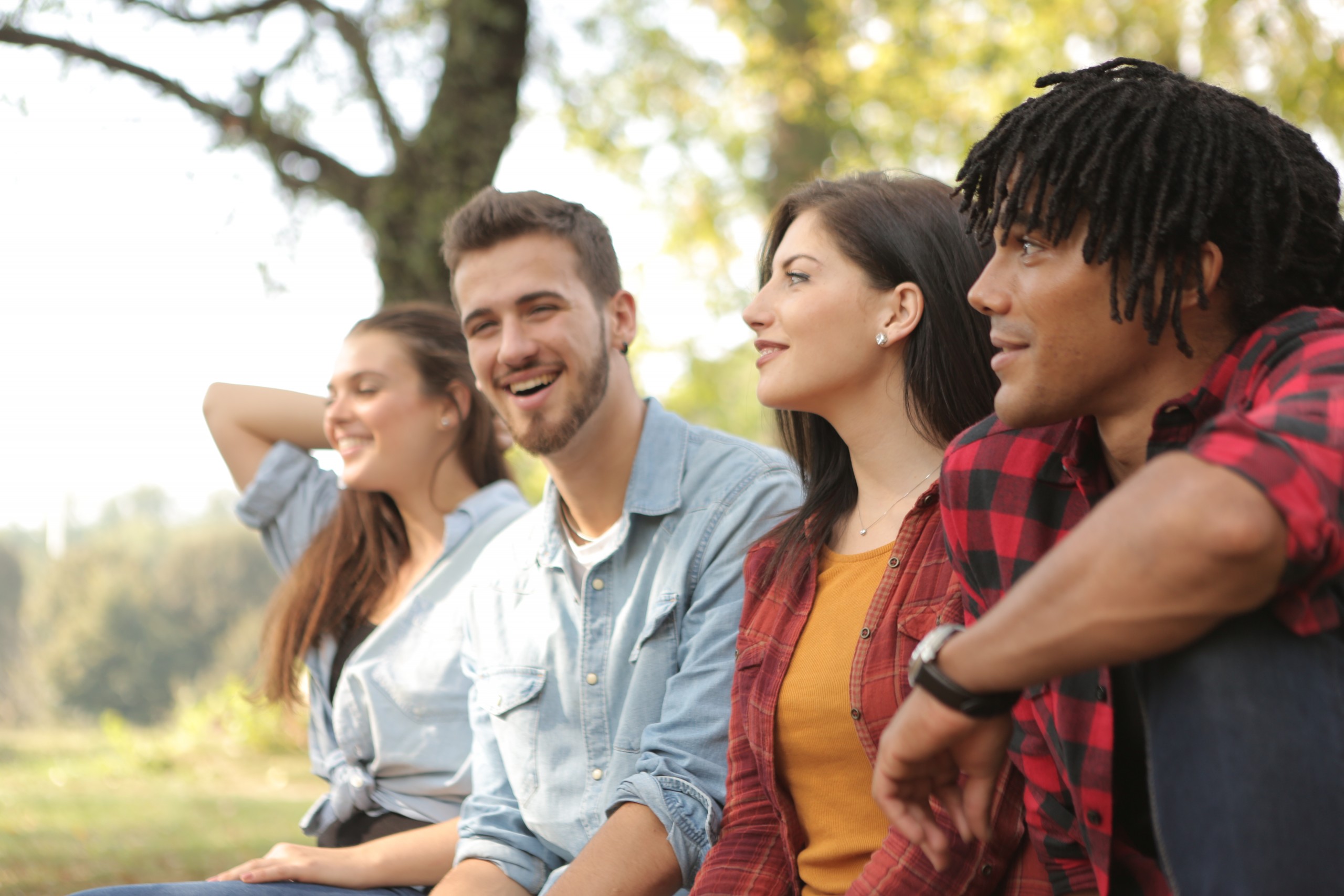 happy-diverse-couples-laughing-in-park-3777727-2